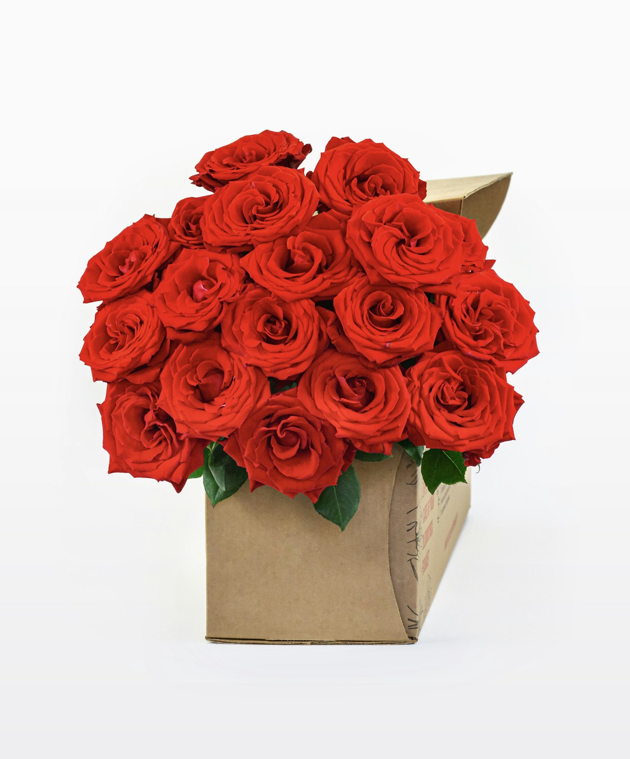 Vibrant red rose bouquet beautifully presented in a chic gift box with lush greenery.