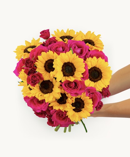 Vibrant bouquet of yellow sunflowers and pink roses, perfect for celebrations.
