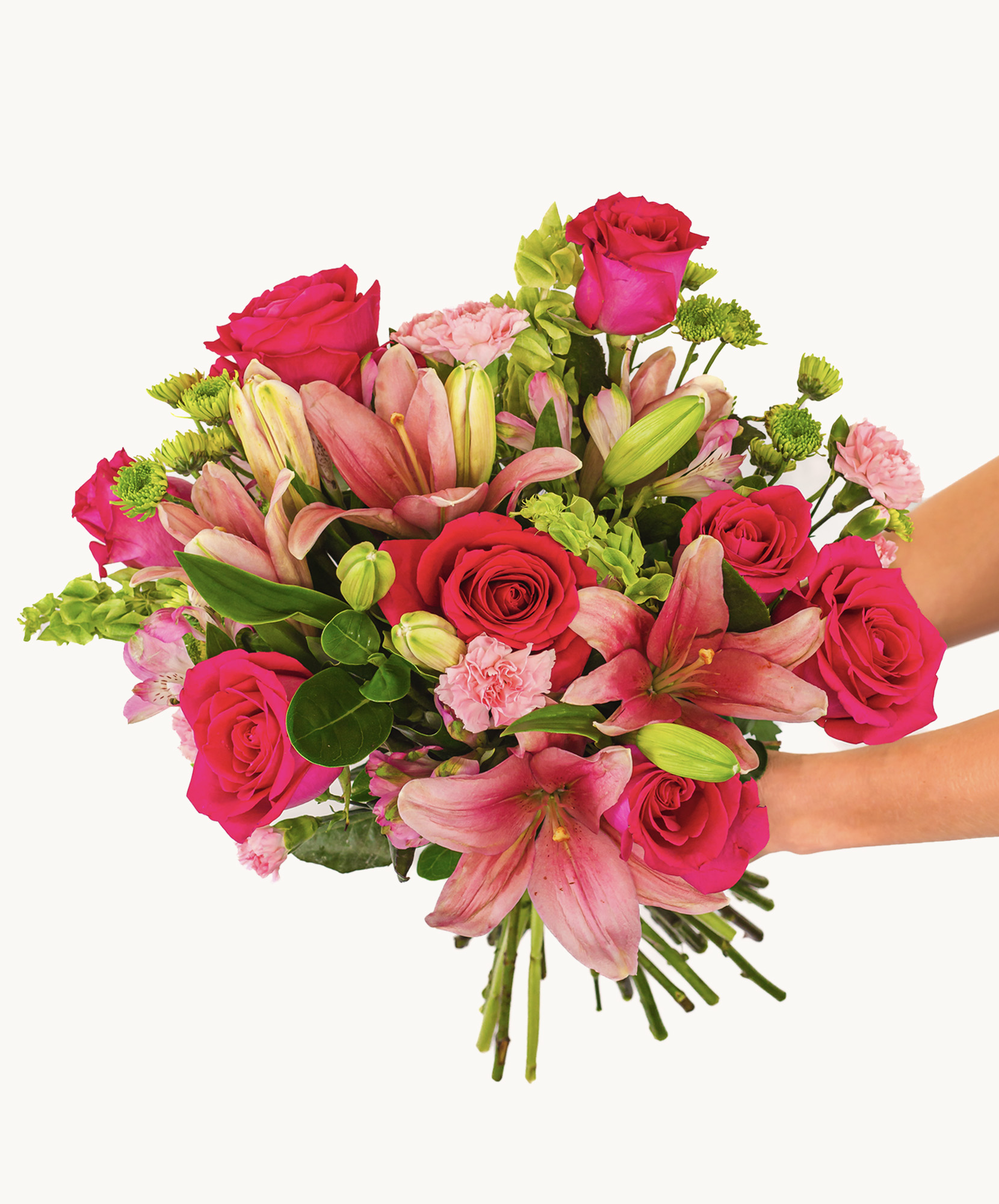 Vibrant bouquet featuring pink roses, lilies, and assorted greens in a stunning floral arrangement.