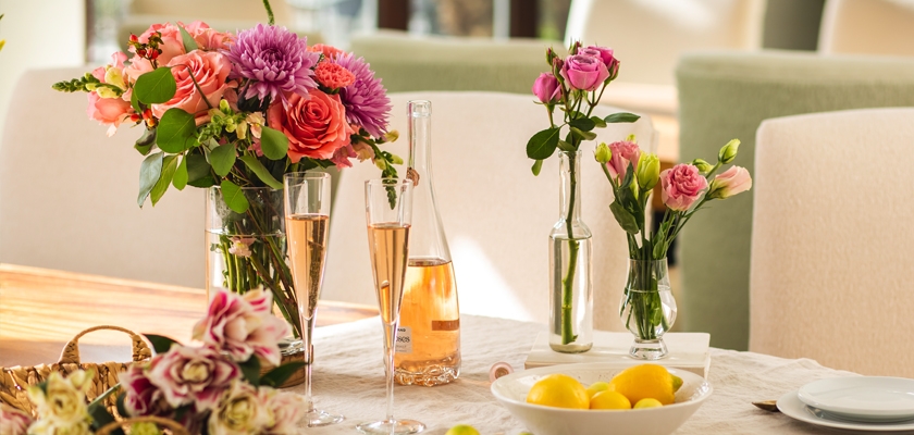 Vibrant floral arrangements with pink and orange blooms, perfect for celebrations and gatherings.