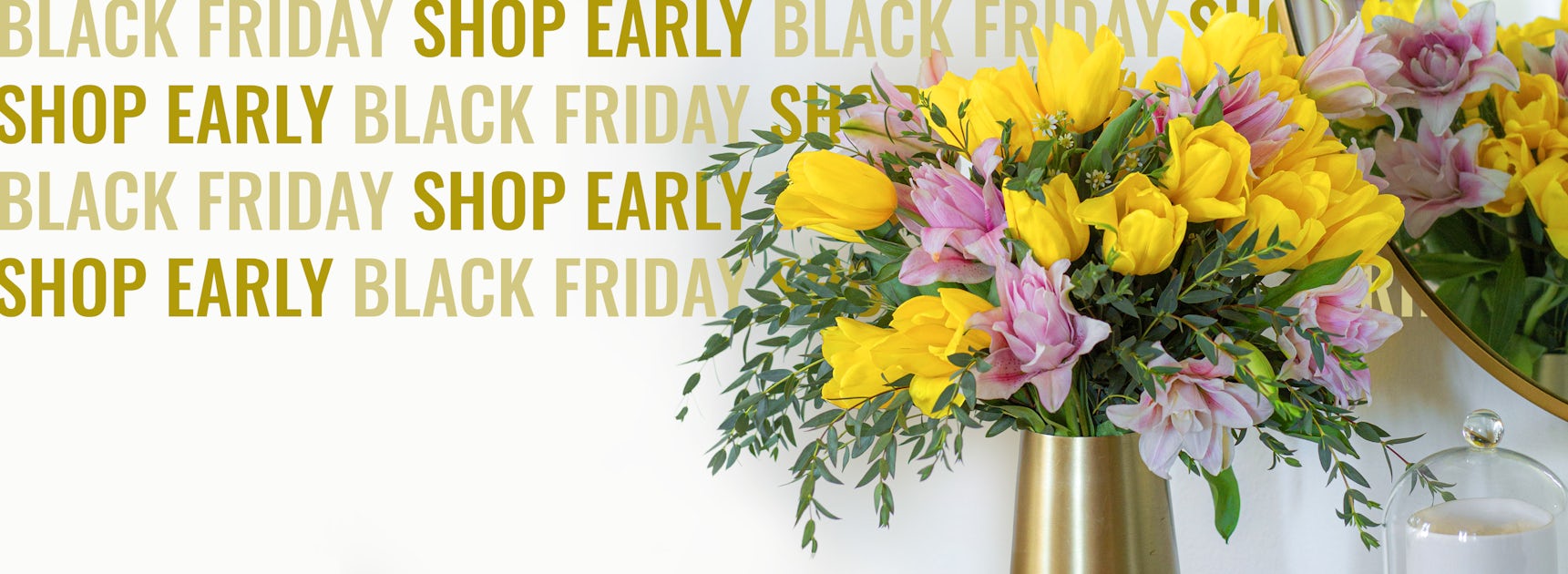 Bright yellow tulips and pink flowers in a stylish vase, promoting early Black Friday deals.