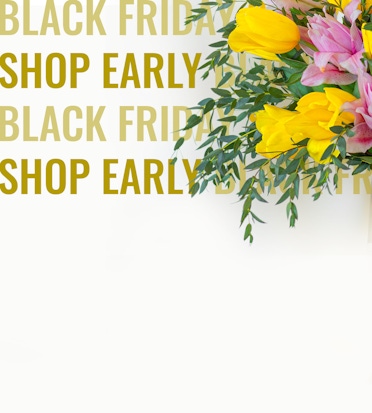 Bright yellow tulips and pink flowers in a fresh bouquet, perfect for Black Friday promotions.