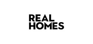 Black text on a white background reads "REAL HOMES" in bold, capitalized letters, suggesting a logo or heading for a housing-related concept.