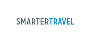 Logo of SmarterTravel in grey and blue font on a white background, symbolizing a brand focused on travel advice, planning, and resources.
