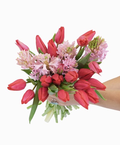 Vibrant bouquet featuring pink tulips and fragrant hyacinths, perfect for any celebration.