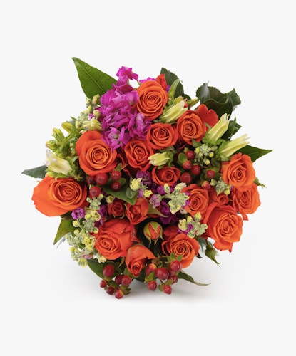 Vibrant bouquet of orange roses, green accents, and purple blooms, perfect for any occasion.