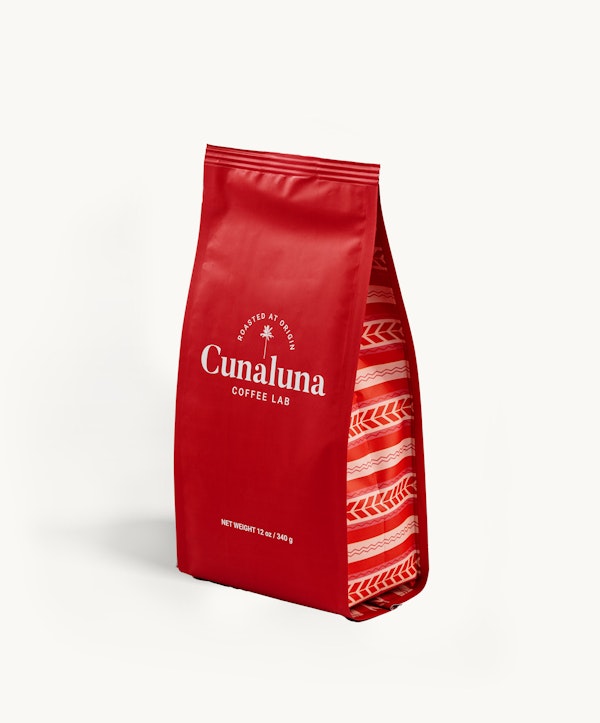 Red Cunaluna Coffee Lab bag with white branding text, isolated on a white background, displaying the net weight of 12 oz (340g) with a patterned design.