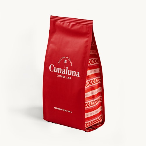 Red Cunaluna Coffee Lab bag with white labeling on a plain background, indicating a net weight of 12 oz (340 g), showcasing premium branding and packaging design.