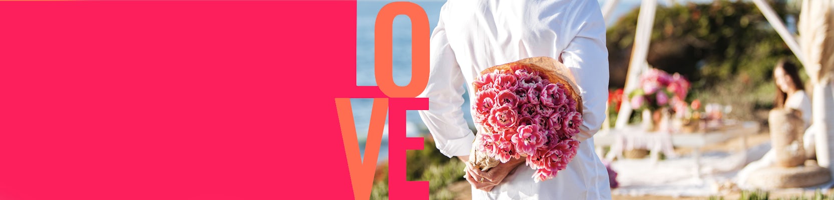 A person holds a bouquet of pink flowers, symbolizing love at a romantic outdoor event.
