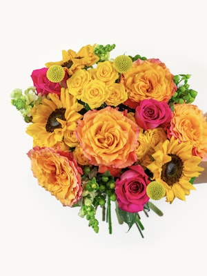 Vibrant bouquet featuring sunflowers, orange roses, and pink blooms, ideal for any celebration.