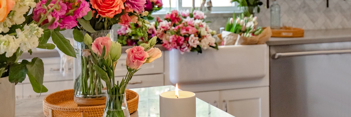 Bright and colorful floral arrangements in a stylish kitchen setting, creating a cheerful ambiance.