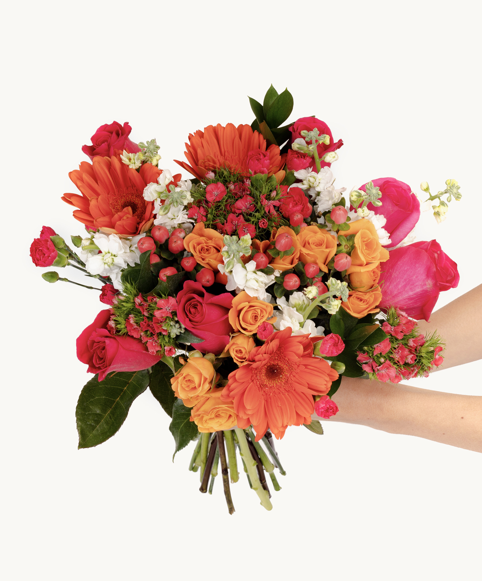 Vibrant bouquet featuring orange gerbera daisies, pink roses, and lush greenery.
