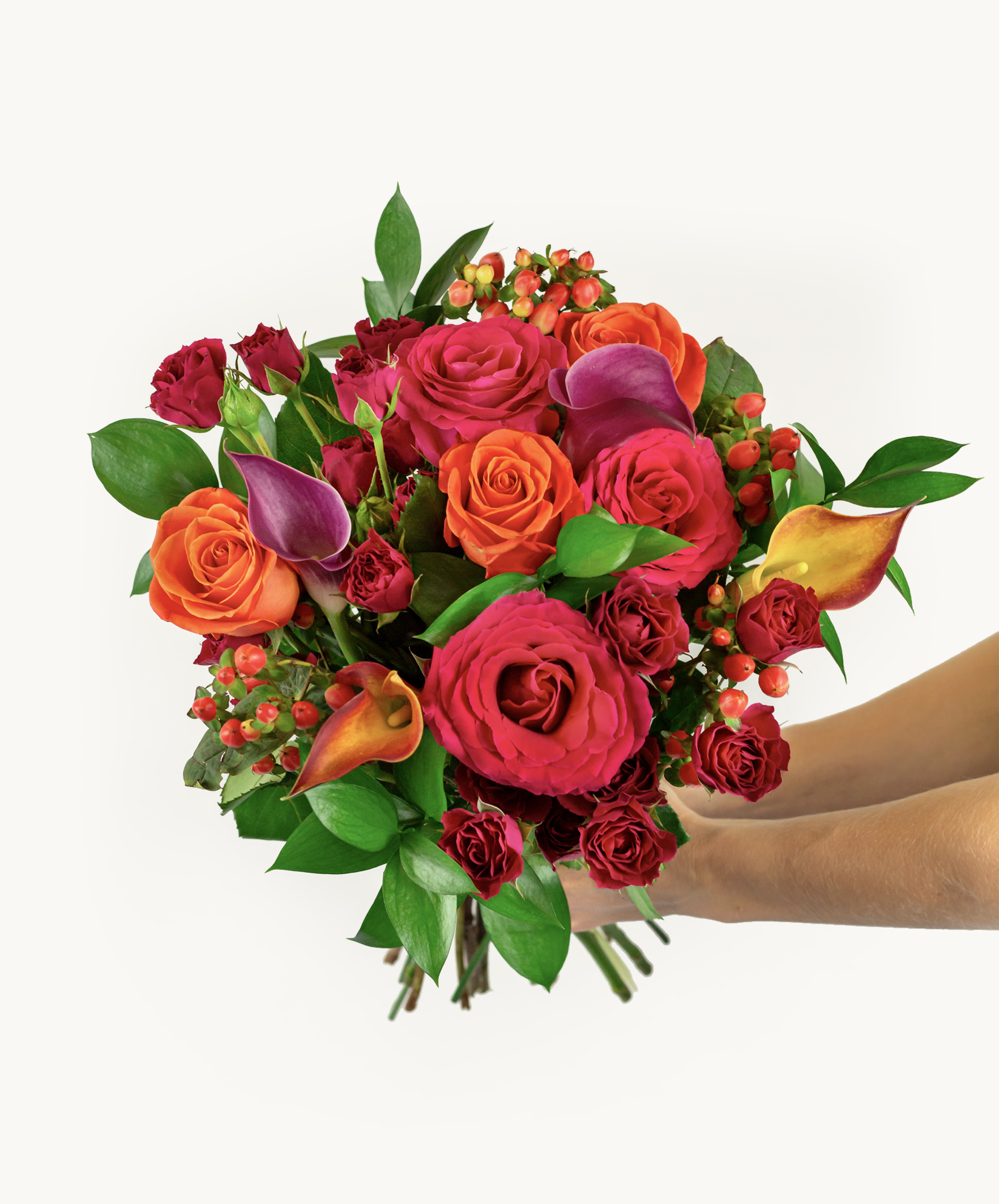 Beautiful hand-held bouquet featuring vibrant red, orange, and purple roses and greenery.