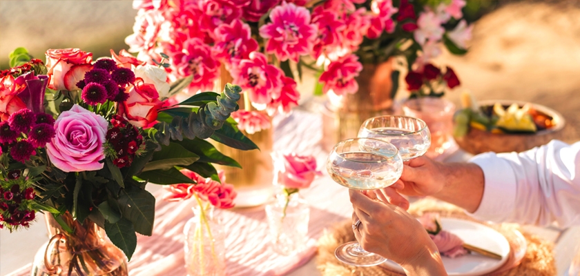 Elegant floral arrangement featuring pink roses and vibrant blooms, perfect for celebrations.