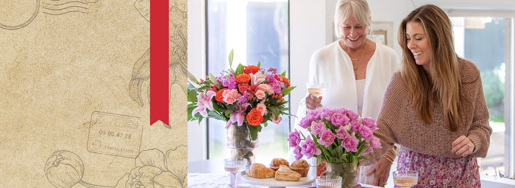 Two women enjoying a cheerful gathering with a vibrant floral arrangement and pastries.