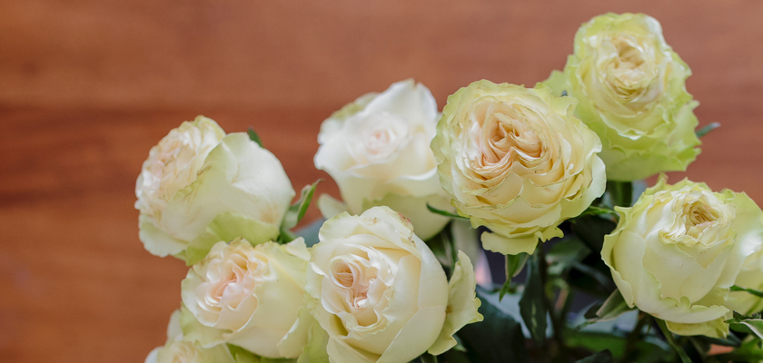 Elegant bouquet of creamy white and soft green roses, perfect for any occasion.