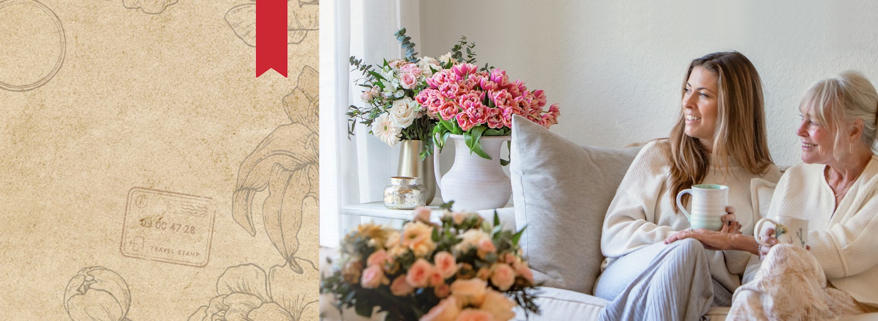Two women enjoying time together on a cozy sofa, surrounded by beautiful floral arrangements.