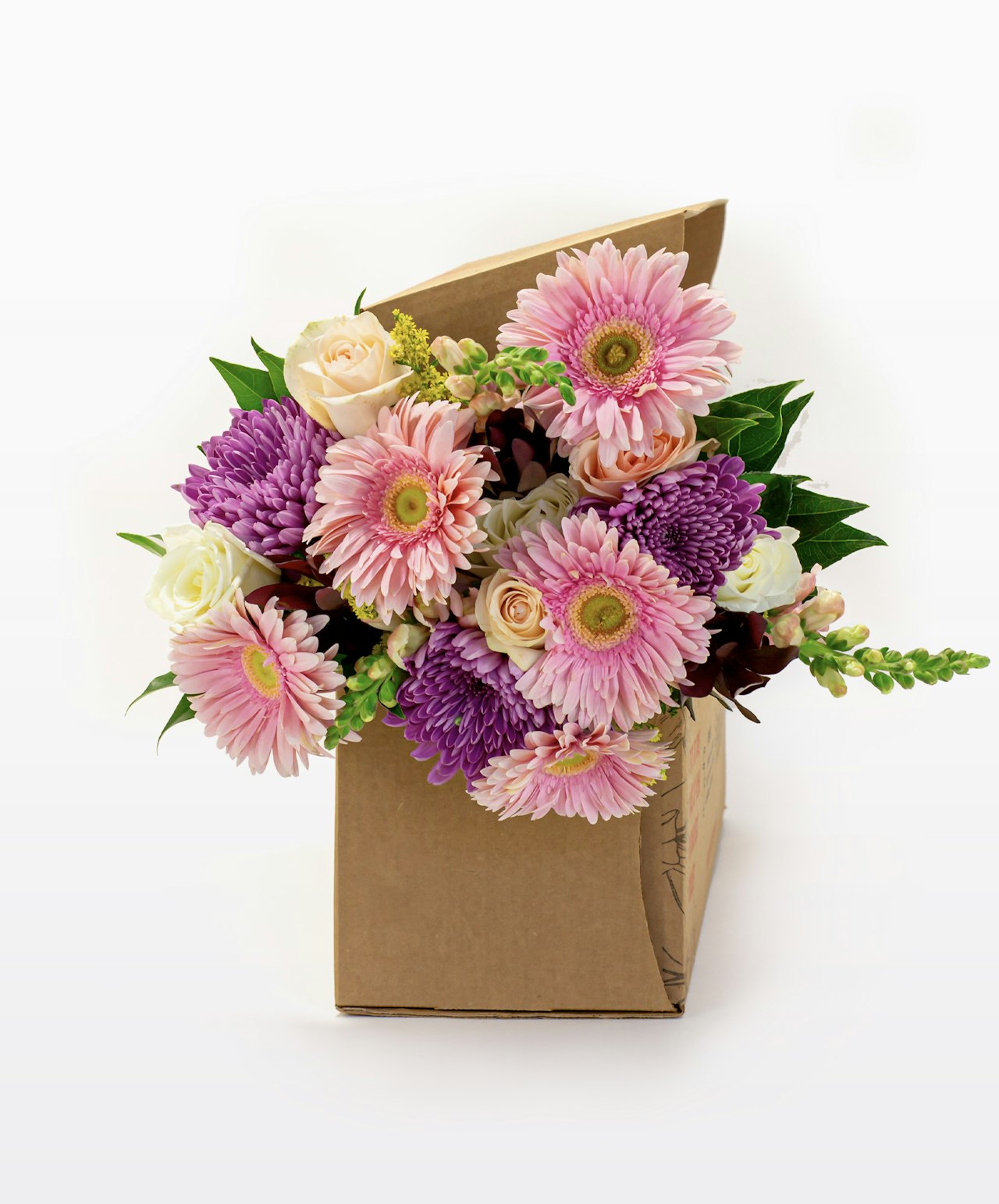 Vibrant floral bouquet featuring pink gerbera daisies and elegant roses in a delivery box.