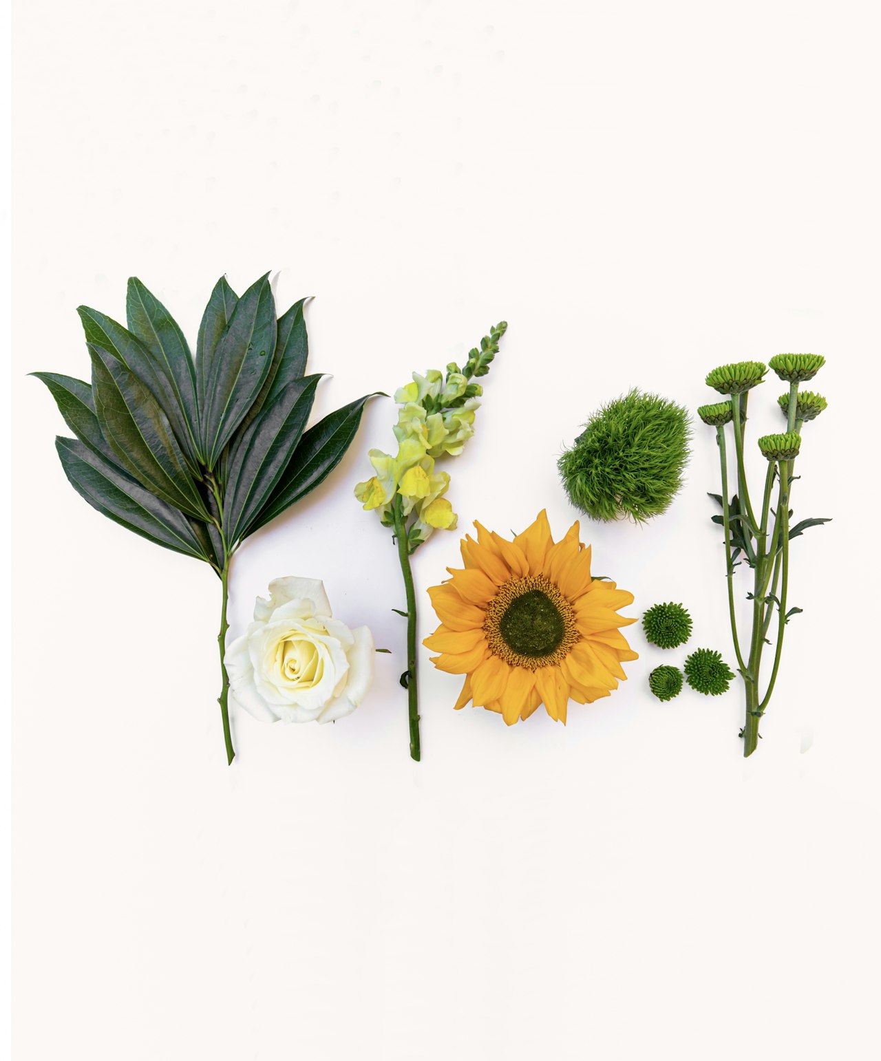 A vibrant arrangement featuring sunflowers, roses, and greenery, ideal for creative floral designs.