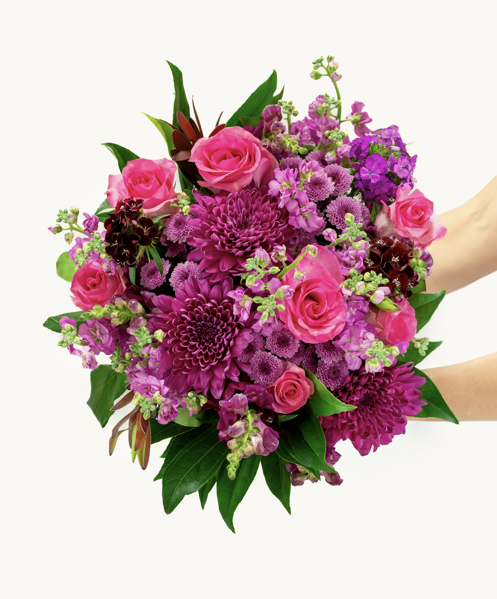 Vibrant bouquet featuring pink roses and purple blooms, ideal for celebrations and gifts.