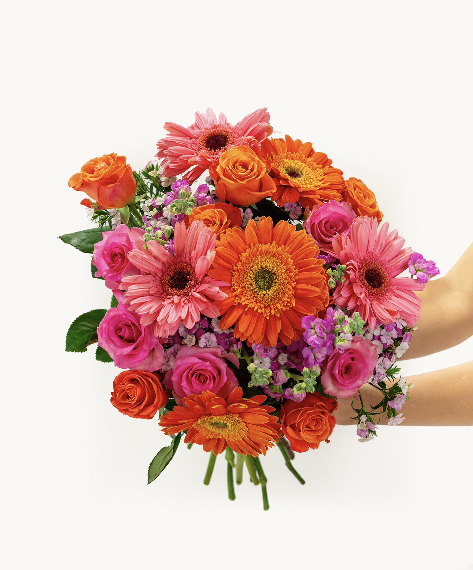 A vibrant pet-friendly bouquet with orange and hot pink roses, daisies, and small pink flowers