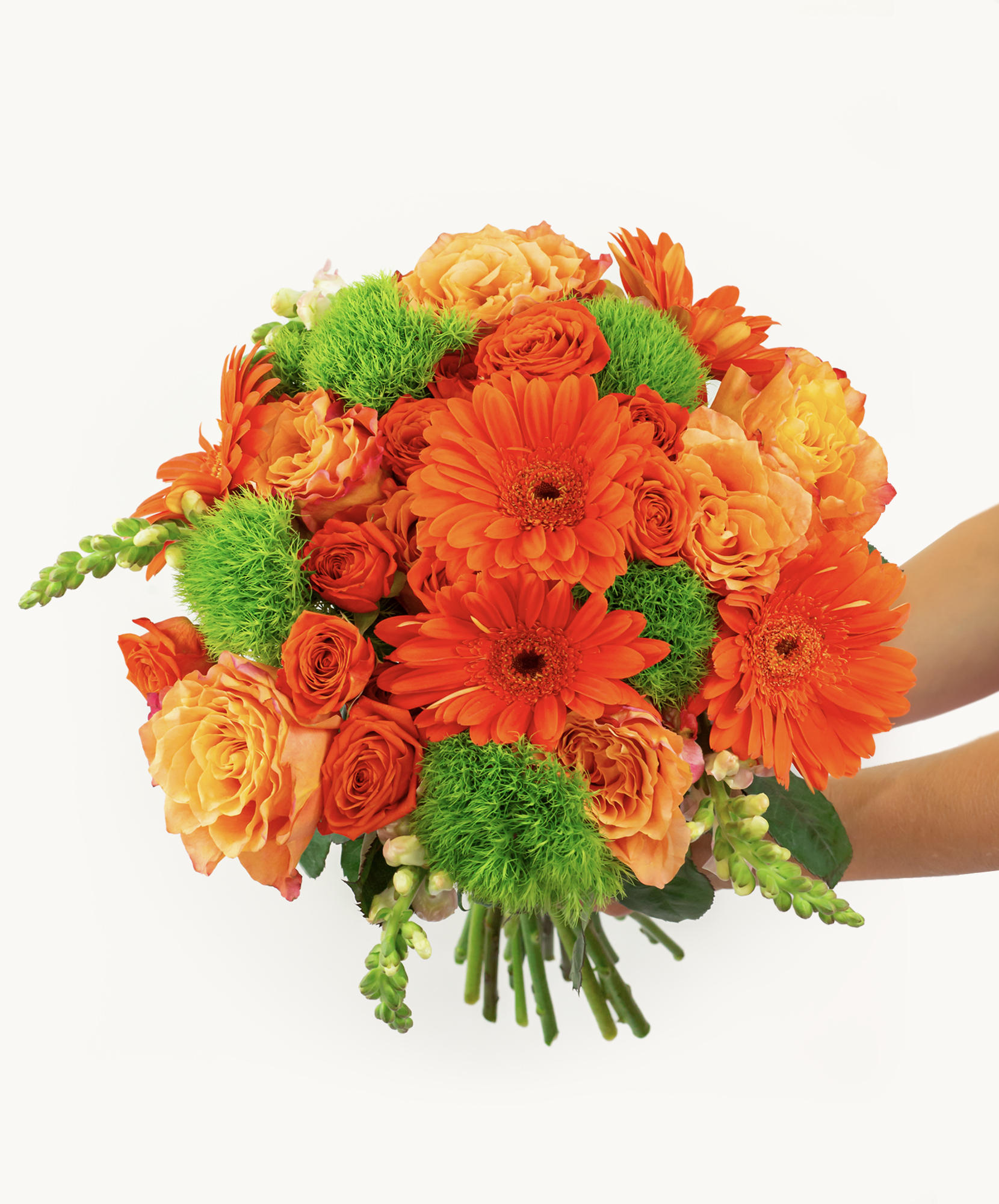 Vibrant bouquet featuring orange gerbera daisies and soft peach roses, accented with lush greenery.