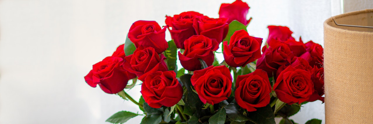 Vibrant bouquet of deep red roses arranged elegantly, perfect for expressing love and affection.