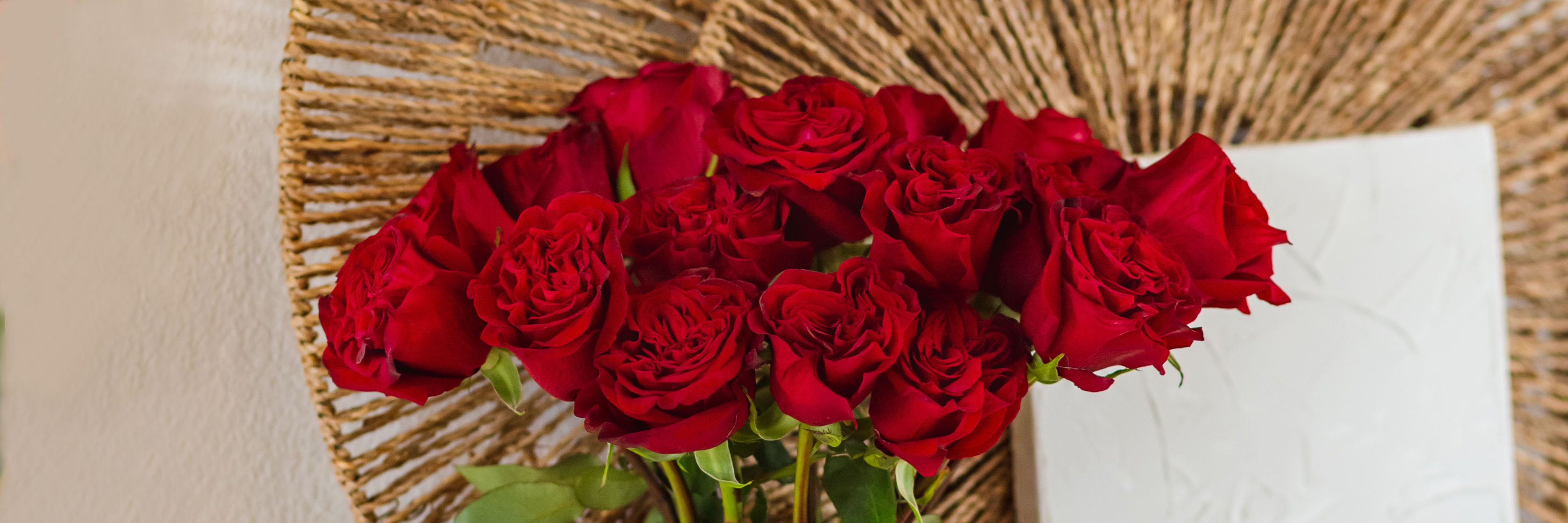 Vibrant red roses elegantly arranged, showcasing freshness and beauty in a natural setting.