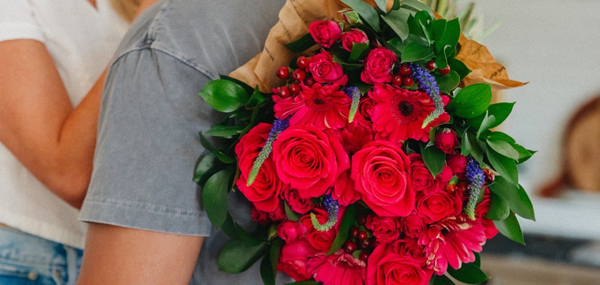 Vibrant bouquet of pink roses and mixed flowers, perfect for celebrations and gifts.