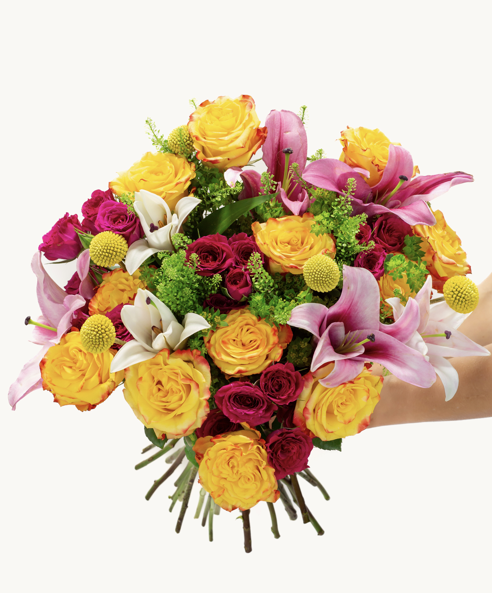 Vibrant bouquet of yellow roses, pink lilies, and colorful blooms, perfect for celebrations.
