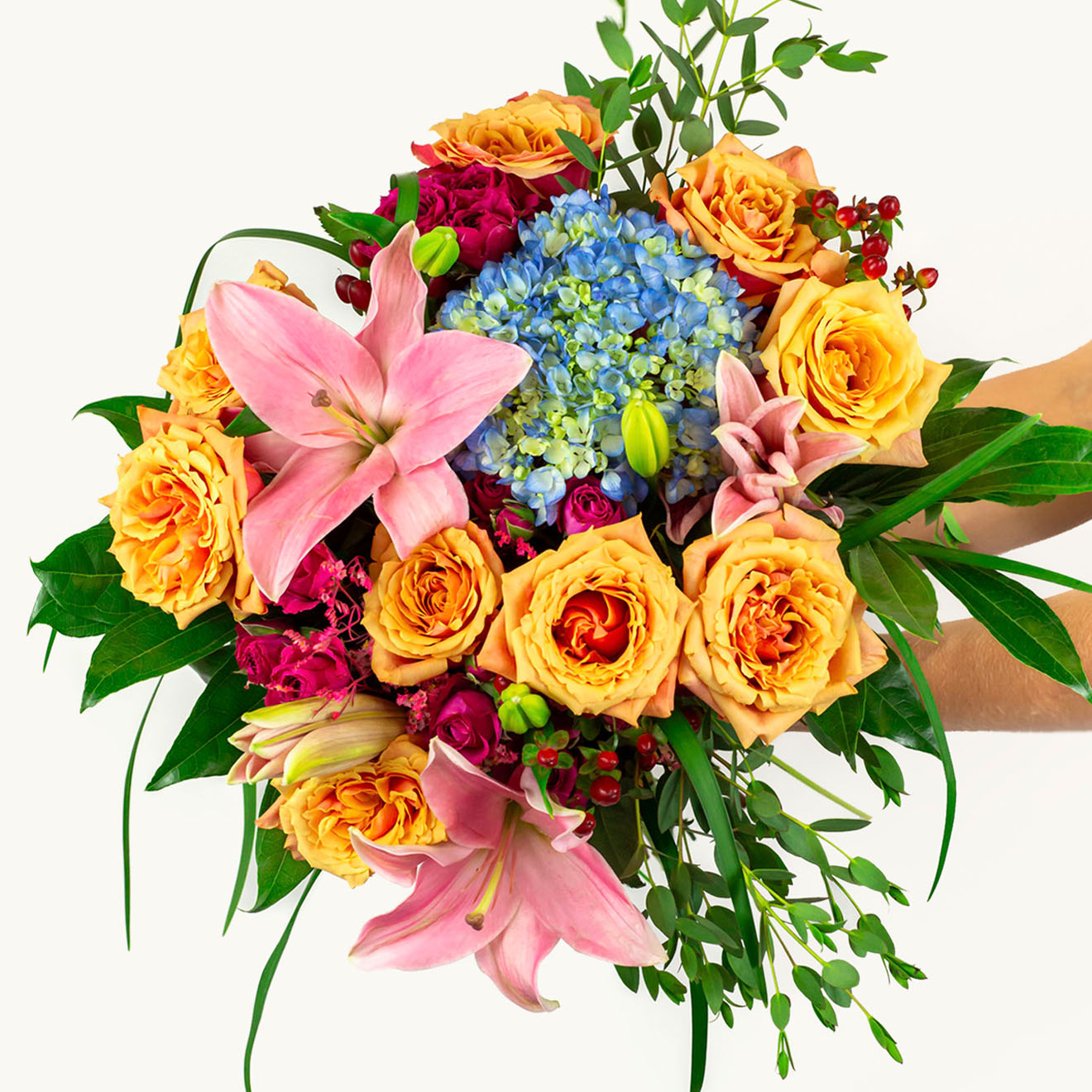 Vibrant floral bouquet featuring lilies, roses, and hydrangeas in cheerful colors.