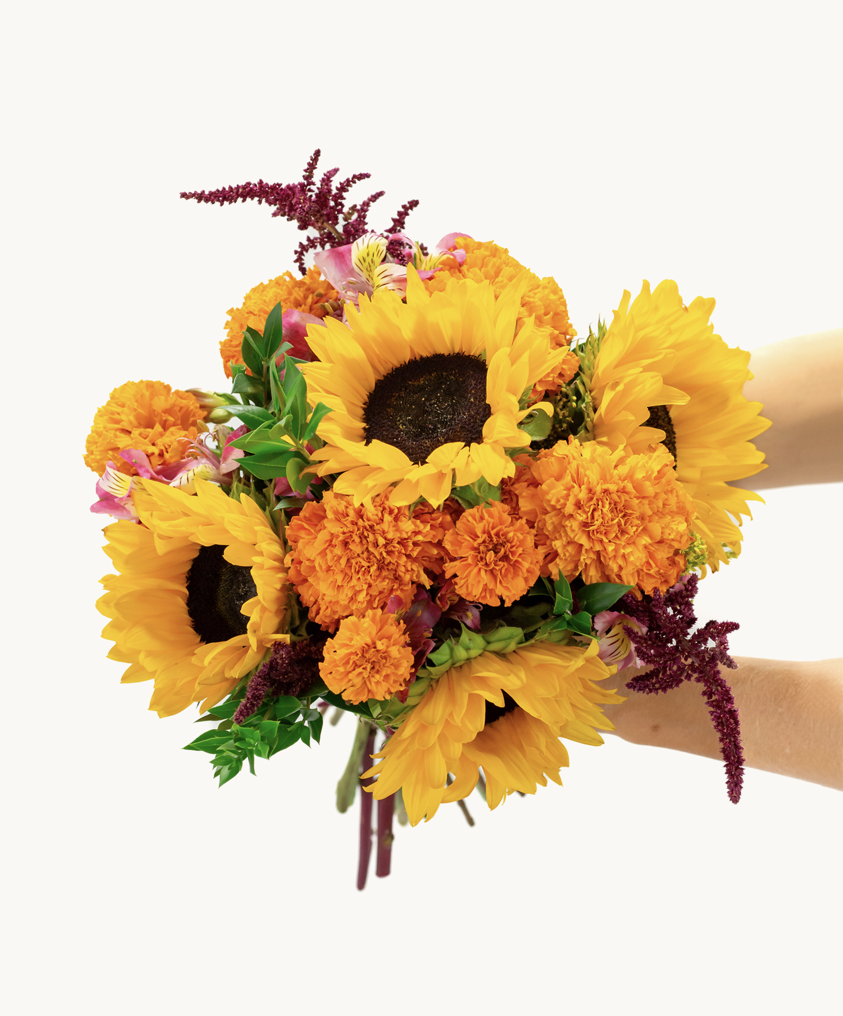 Vibrant sunflower bouquet with marigolds and colorful accents, perfect for cheerful occasions.