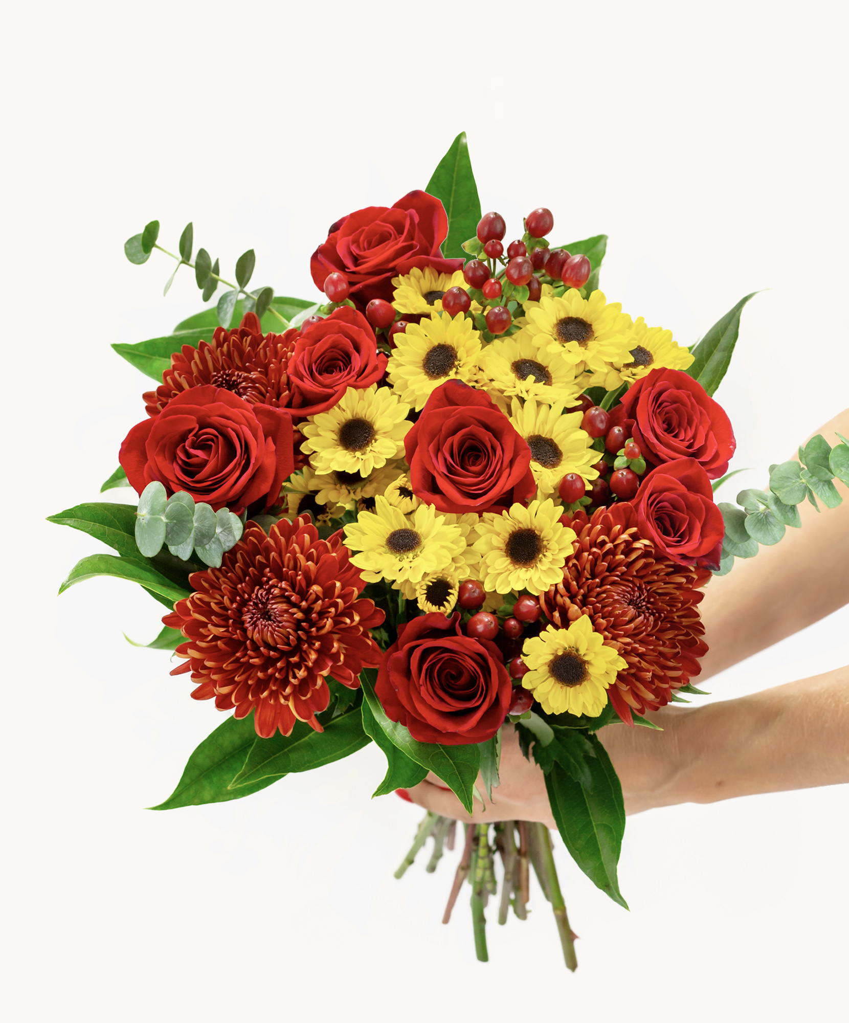Vibrant bouquet featuring red roses, yellow daisies, and rich chrysanthemums with greens.