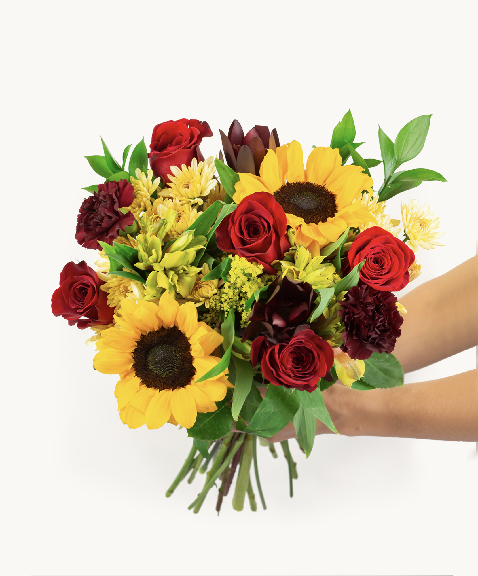 Vibrant mixed flower bouquet featuring sunflowers, red roses, and greenery, perfect for gifts.