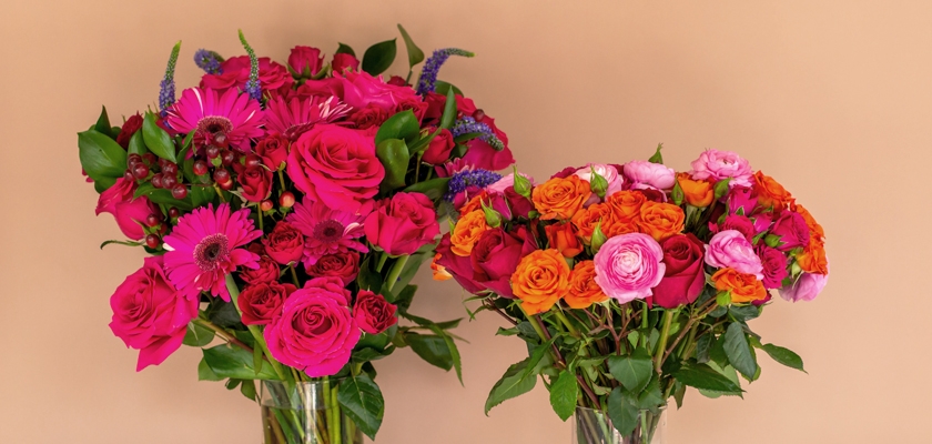 Vibrant floral arrangements featuring pink and orange roses, gerbera daisies, and lush greenery.