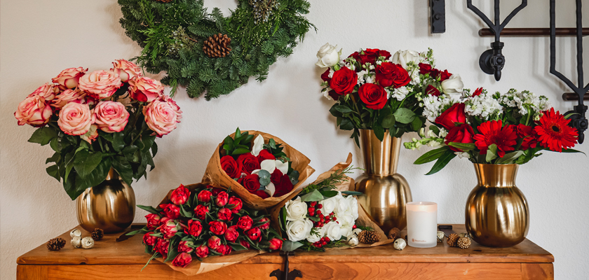 Vibrant floral display featuring red and pink roses in elegant vases, perfect for decor.