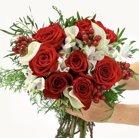 Vibrant bouquet featuring red roses, white flowers, and lush greenery, perfect for any celebration.