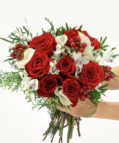 Vibrant bouquet featuring red roses, white flowers, and lush greenery, perfect for any celebration.