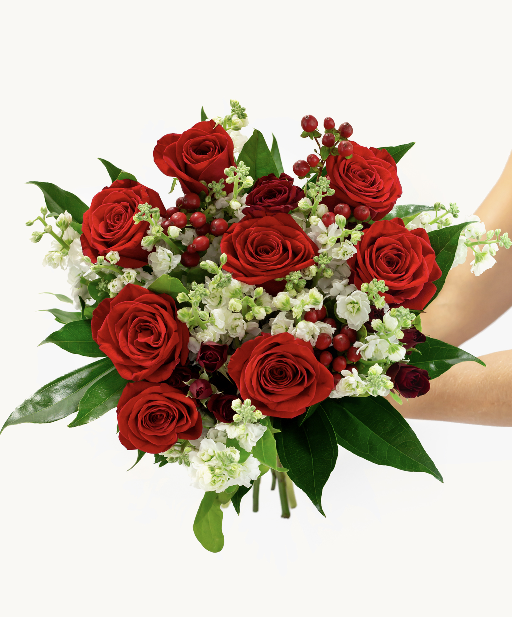 Vibrant red roses paired with white blossoms and green foliage, ideal for any celebration.
