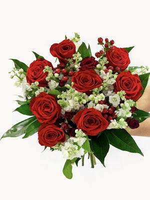 Vibrant red roses paired with white blossoms and green foliage, ideal for any celebration.