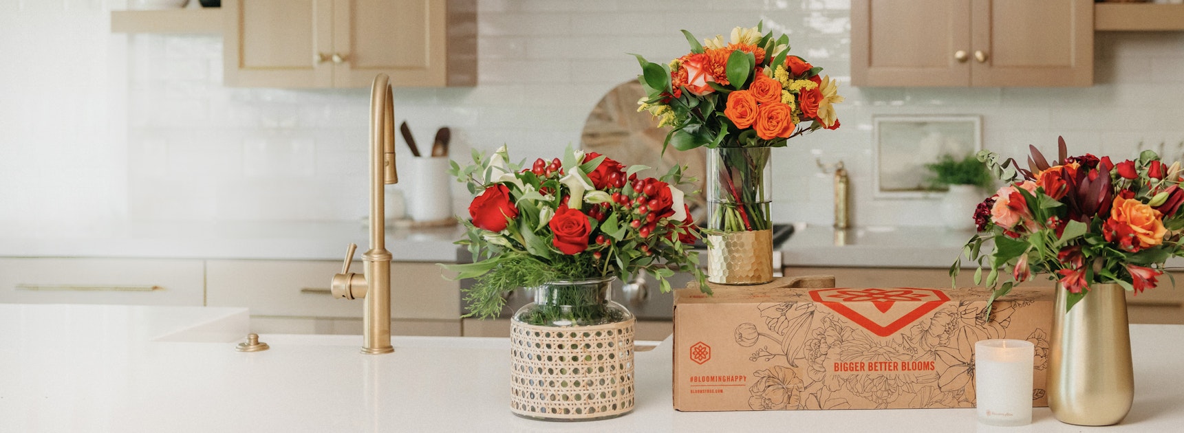 Vibrant floral arrangements featuring roses and seasonal blooms in a modern kitchen setting.