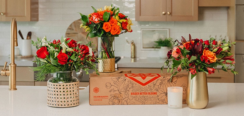 Vibrant flower arrangements in decorative vases, adding color and charm to a modern kitchen.
