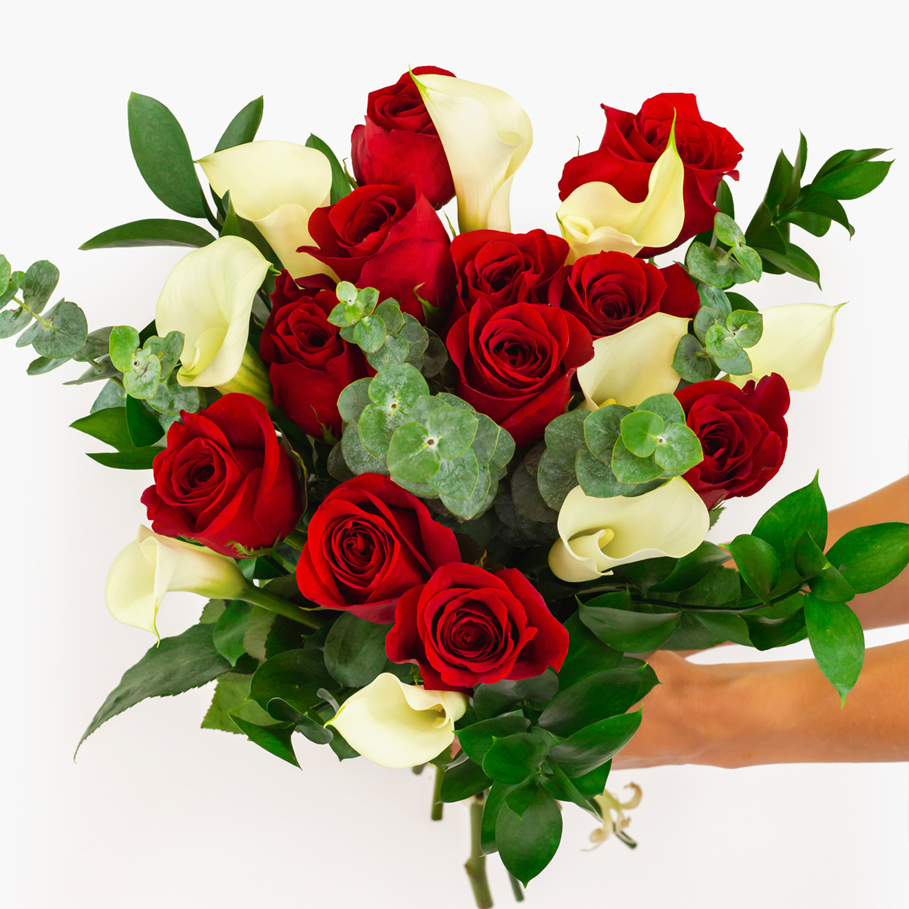 Vibrant bouquet featuring red roses and white calla lilies, beautifully arranged.