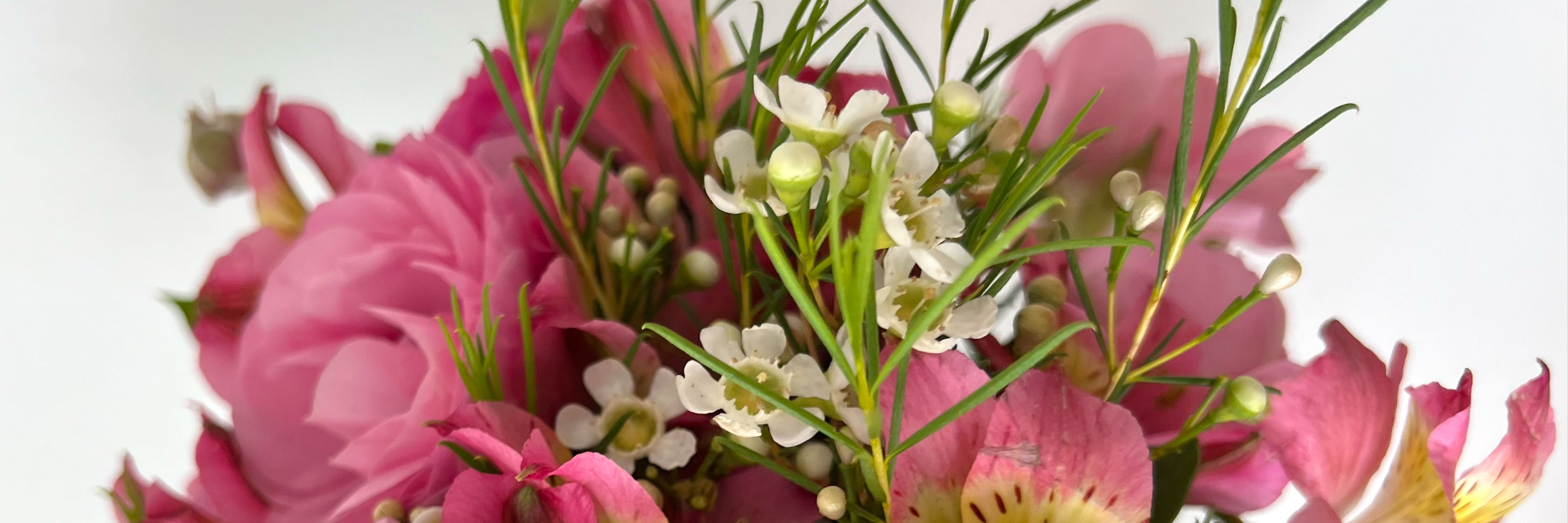 Vibrant bouquet featuring delicate pink blooms and white accents, perfect for brightening any space.