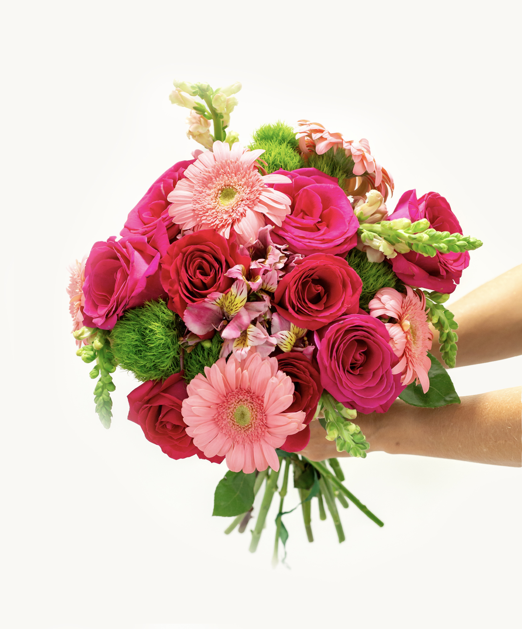 A vibrant floral bouquet with pink and green hues, featuring roses, alstroemerias, and lilies
