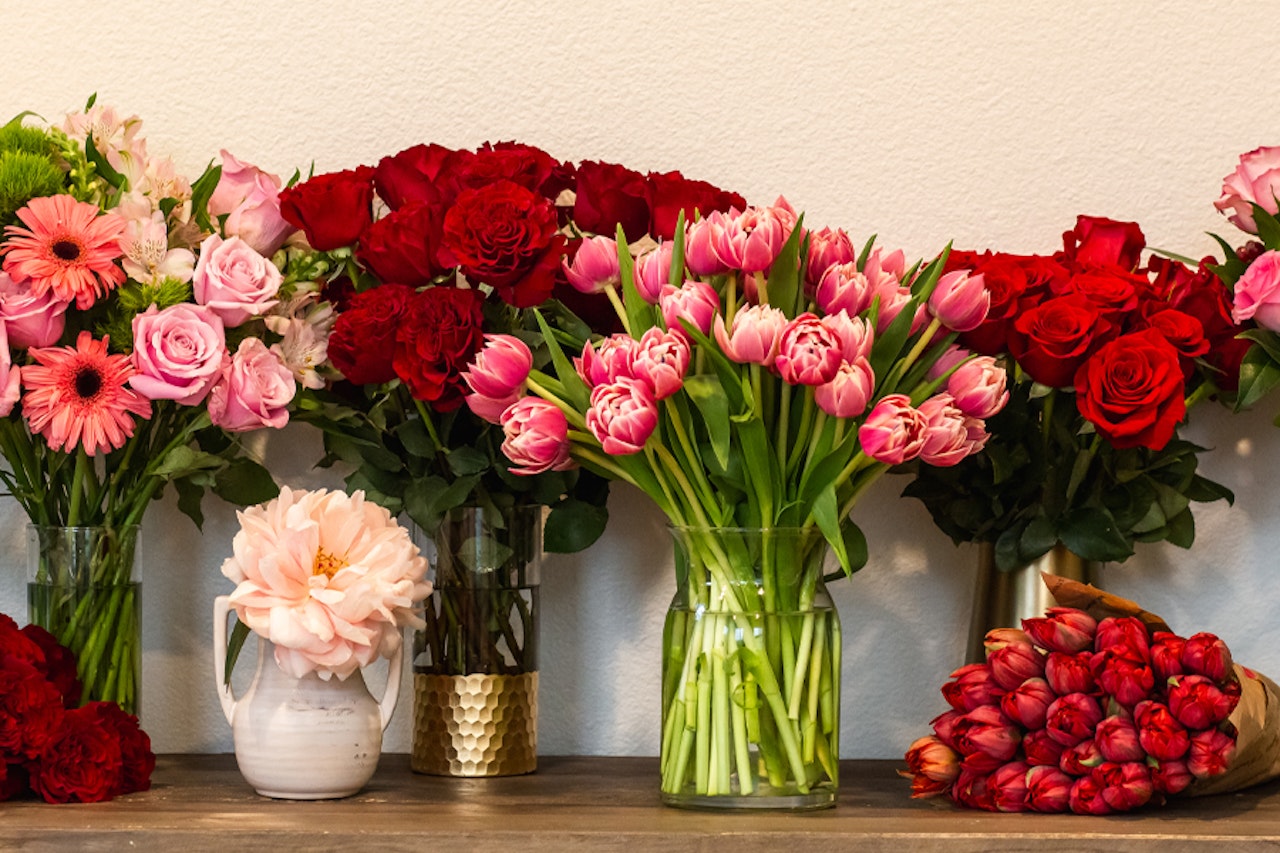 A colorful assortment of fresh flowers including roses, tulips, and gerbera daisies.