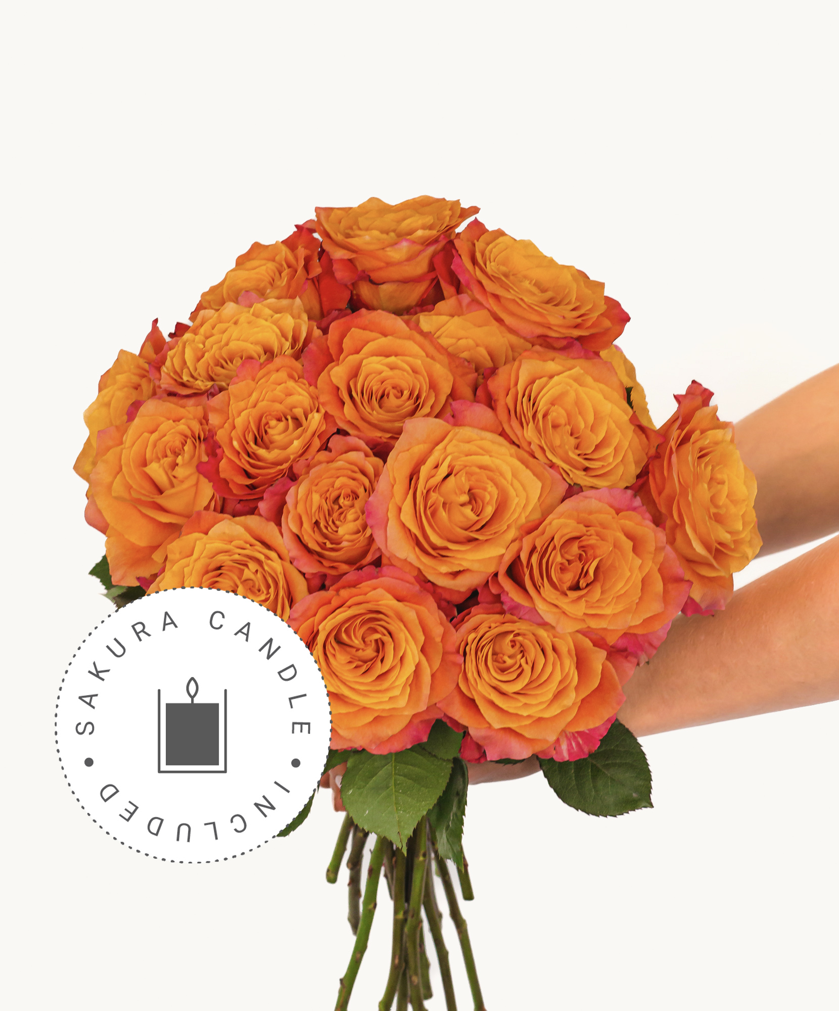 Vibrant orange rose bouquet held with care, ideal for seasonal celebrations and special moments.