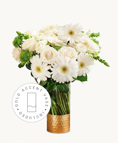 Elegant white roses and gerbera daisies in a chic gold vase, perfect for any occasion.