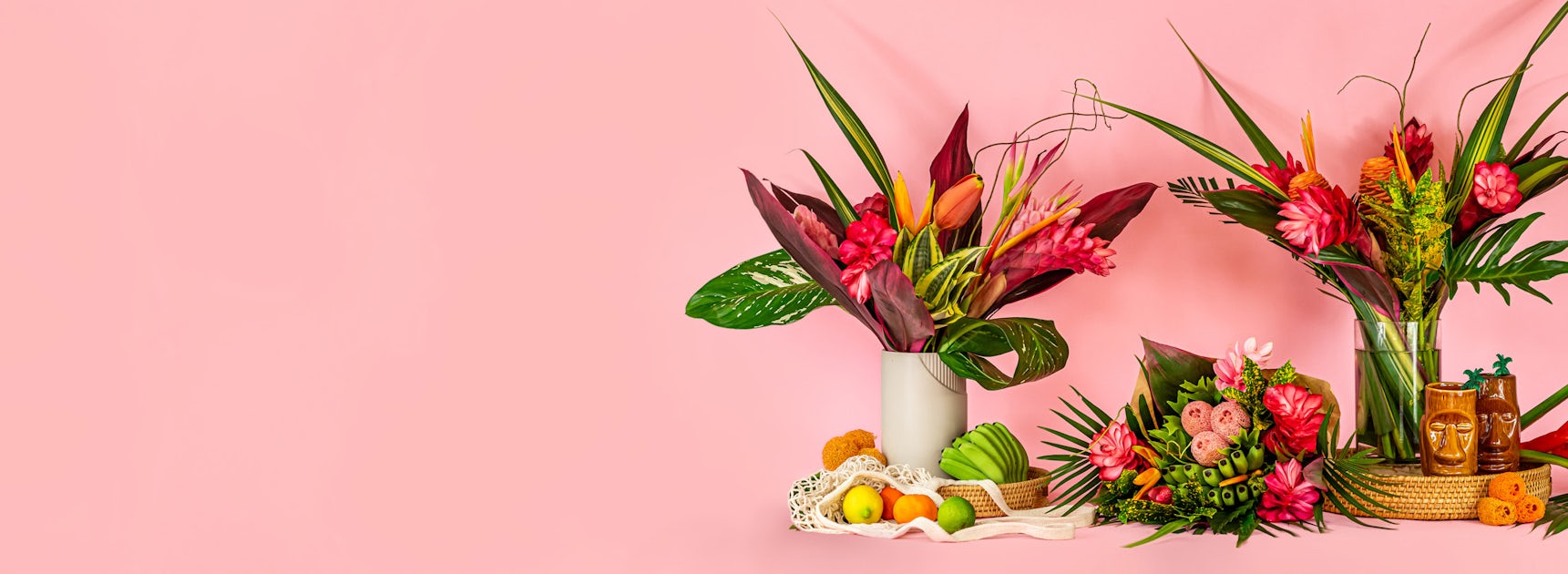 Vibrant tropical flower arrangements featuring pink blooms and lush greenery on a pastel background.