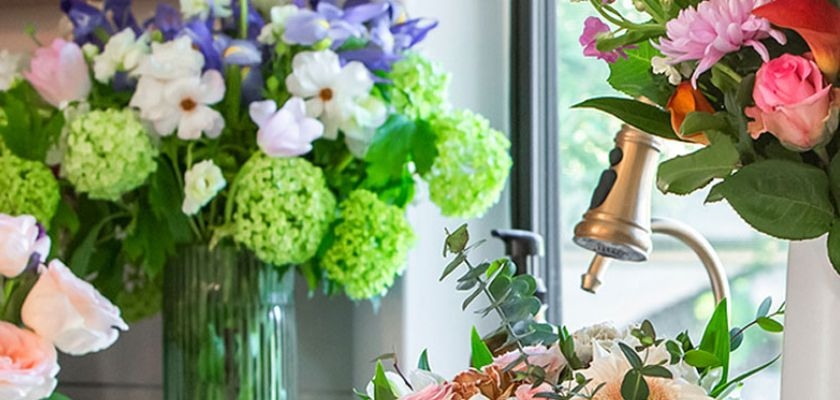 Vibrant floral arrangements featuring roses, daisies, and seasonal blooms in elegant vases.